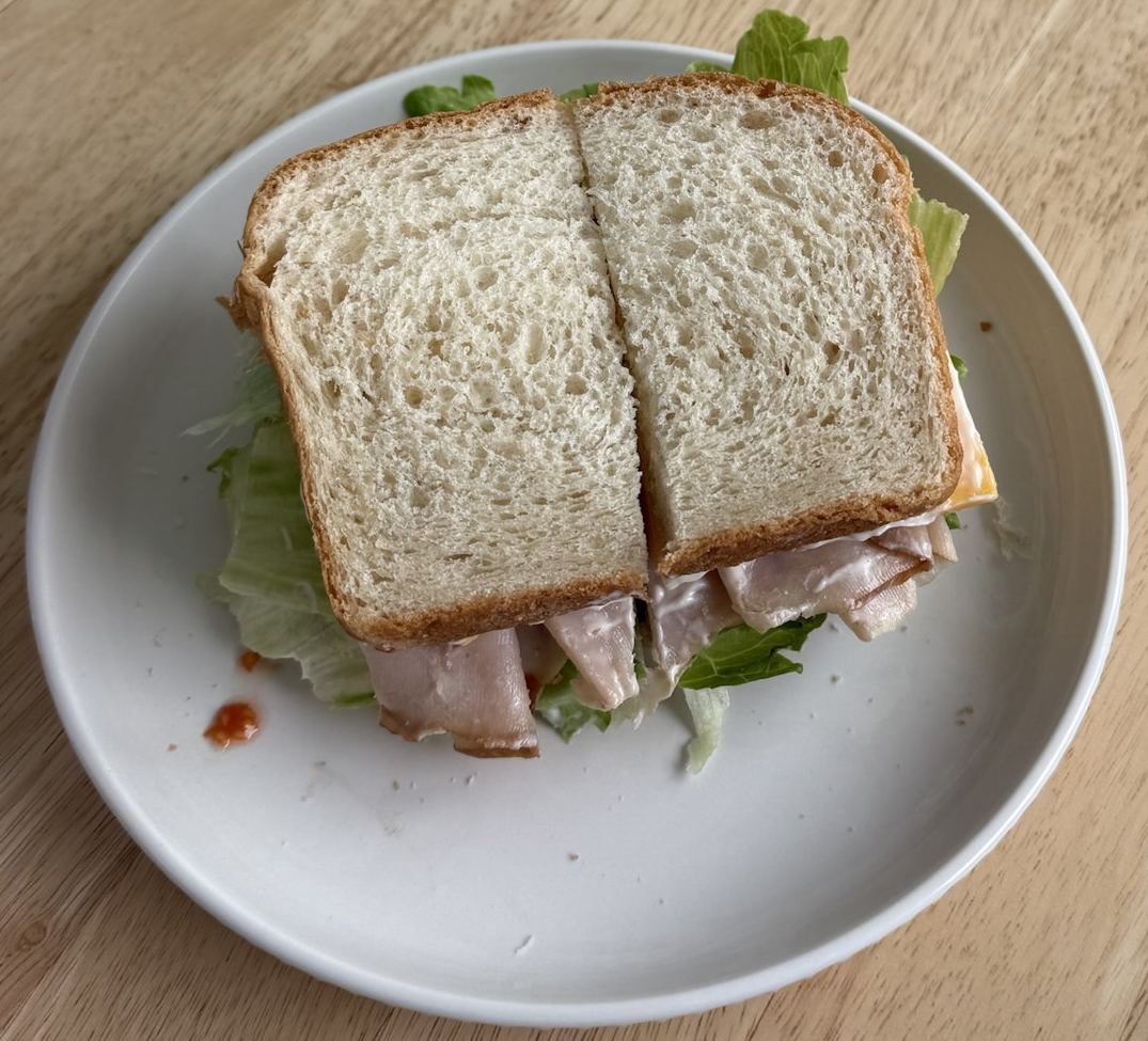 Turkey, cheese and lettuce sandwich on thick slices of homemade white bread